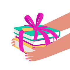 Hands hold a stack of books tied with a bow