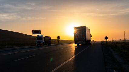 Vehicles exporting at sunrise 