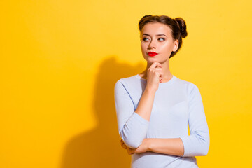 Photo of young smart business lady look blank space consider new project startup ideas isolated on yellow color background
