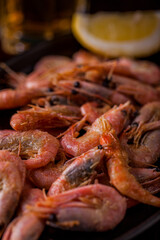 Shrimps fried in creamy sauce and a glass of light beer