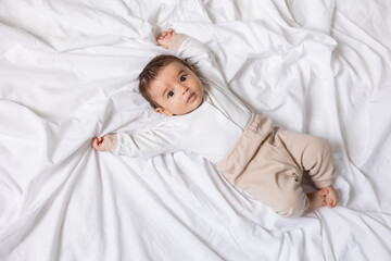 adorable little boy laying on blanket, card, banner, health