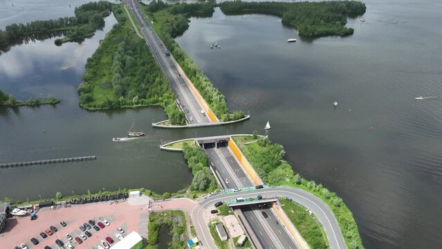 Aqueduct Veluwemeer near Harderwijk transport asphalt motorway road for traffic crossing underneath a waterway river lake infrastructure in the Netherlands. Holland