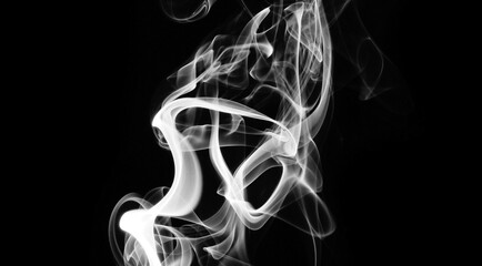 White smoke in a black background