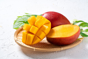 Mango background design concept. Top view Diced fresh mango fruit on white table.