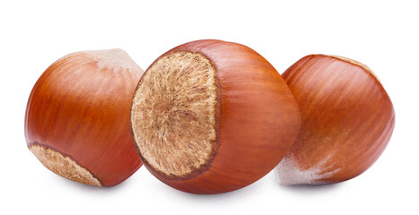 Three delicious hazelnuts, isolated on white background