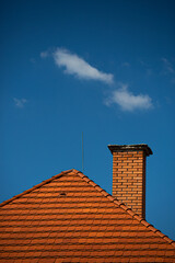 chimney on the roof - obrazy, fototapety, plakaty