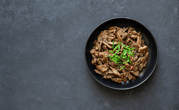 Bulgogi On A Black Background, Korean Beef Dish, Asian Food, Top View, Copy Space