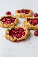 Mini-biscuits made of strawberries on a white background. Delicious mini-pies