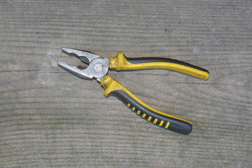 Old pliers with plastic handles.