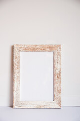 Empty photo frame, leaning against the wall, space for text, photo