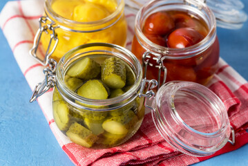 Preserves Vegetables in Glass Jars on Red Napkin Blue Background Homemade Canned Food Above Horizontal