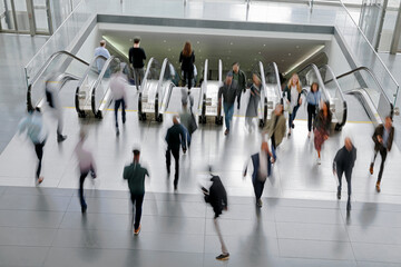 people on moving escalator motion blur