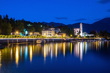 The town of Tremezzina, on Lake Como, photographed in the evening.
