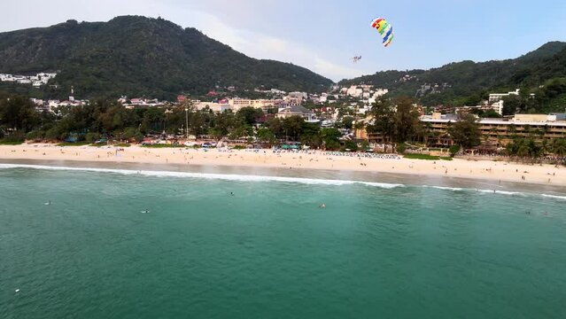 Aerial View Of Parasailer Coming Into Land On Kata Beach In Phuket. Dolly Forward