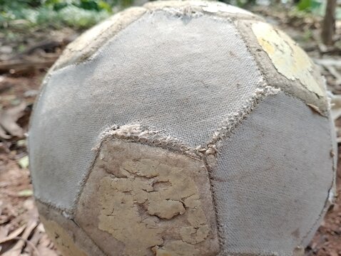 worn, torn and broken ball. football ball