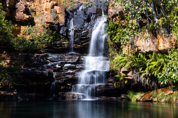 Idyllic Billabong with waterfall and reflections at Galvans Gorge in the Kimberley, Western Australia