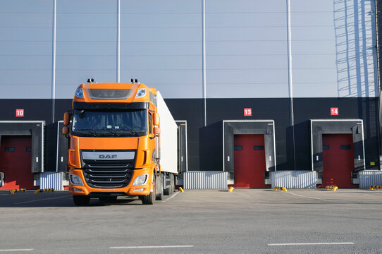 Modern logistics complex. Unloading trucks in a modern warehouse. Logistics.
