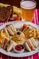 Double sandwich with fries and beer