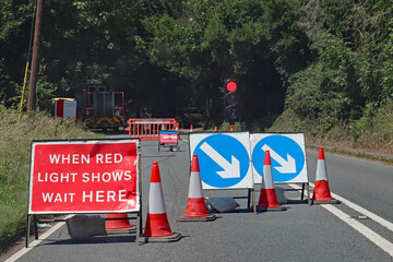 Waiting at a red light at roadworks controlled by traffic lights in Somerset, England. No traffic...