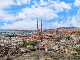 View from the mountain to the old city of Sharm El Sheikh in the valley with the Red Sea on the...