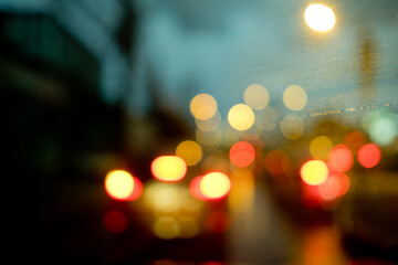 Droplet of water on car mirror, traffic jam
