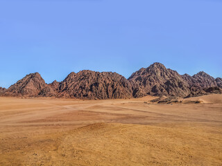 Fototapeta na wymiar Desert mountain landscape in Echo Valley near Sharm El Sheikh, Egypt. Empty Sinai desert, no people. Natural background with copy space