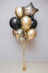 set of black and gold balloons