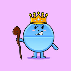 Cute cartoon pill medicine mascot as wise king with golden crown and wooden stick