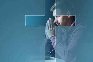 Believing Christian. Man prays to God. Christian crucifix in front of praying man. Catholic guy...