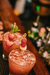 Luxury drink served with strawberries and cherries in exquisite Brazilian bar Pub