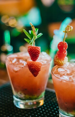 Luxury drink served with strawberries and cherries in exquisite Brazilian Pub beach club