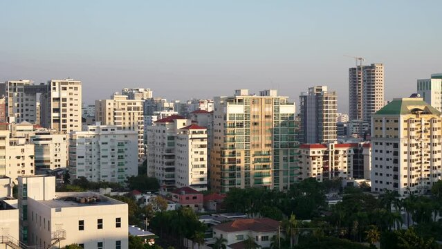 Cityscape of Santo Domingo downtown residential and office buildings in soft evening light, Dominican Republic