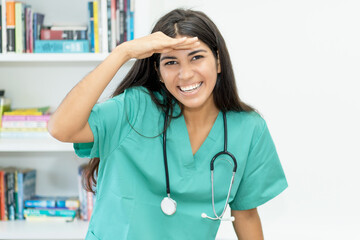 Laughing south american female nurse or doctor