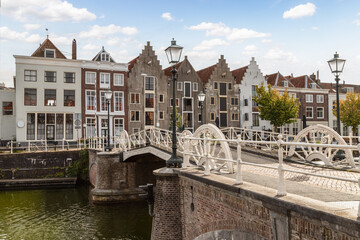 Fototapeta na wymiar Canal houses and drawbridge in the center of the Dutch city of Middelburg in the province of Zeeland.