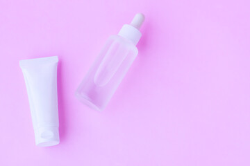 Cosmetic bottles on pink background,Beauty products