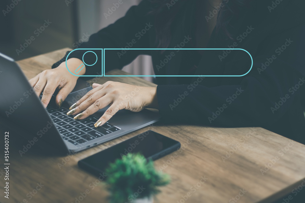 Wall mural the concept of using technology to search engine optimizationfor information business woman using la