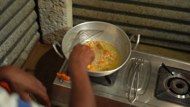 fish frying on pan Karnataka Mysore mysure India poor house.