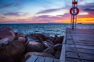 Outlook over the sunset Oresund sea from Scania bath place in Malmo, Sweden