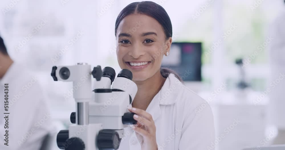 Poster portrait of a female scientist using a microscope in a laboratory. a healthcare professional analyzi