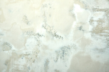 Obraz premium Textured concrete wall with patches of gray and white to use as background