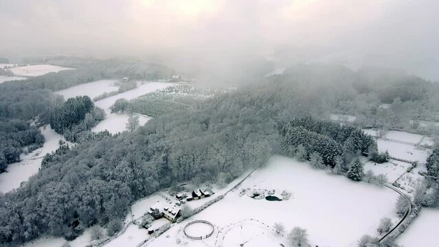 Snowy Winterberg Schwelm Droneshot into out of clouds