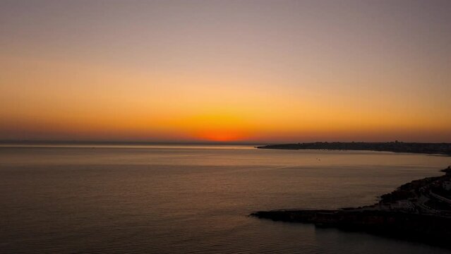 Time lapse video of sunset over ocean in Cascais