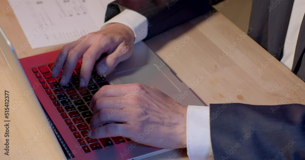 Poster close-up of a man's hands typing text on a laptop keyboard. he makes an email. using speed dial, com