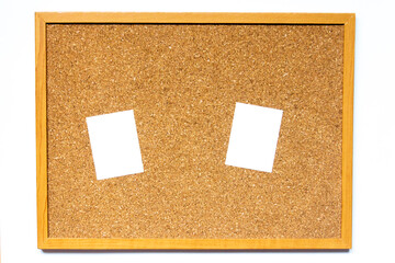 Corkboard with white note paper placed on white background with copy space
