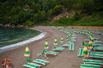 Sun loungers and umbrellas on the Sassolini beach.