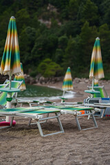Sun loungers and umbrellas on the private beach.
