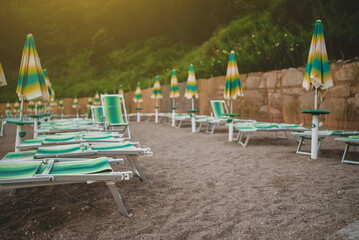 Sun loungers and umbrellas on the private beach.
