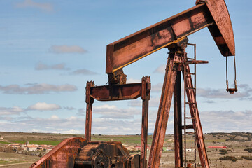 Oil pumping machine. Pump jack. Petroleum extraction. Global warming