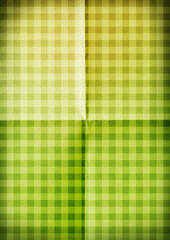 Green background. Tablecloth tartan pattern. Folded paper texture