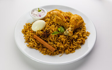 Chicken biryani Spicy Indian Malabar biryani Hyderabadi biryani pulao with egg. Beautiful shot of Kerala India Sri Lanka style biriyani made of basmati rice